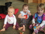 Brianna, Bella, and Roiya, all looking rather serious, with Girl in the background