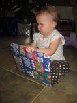 Bella unwrapping the magnetic go-fishing puzzle we got for her