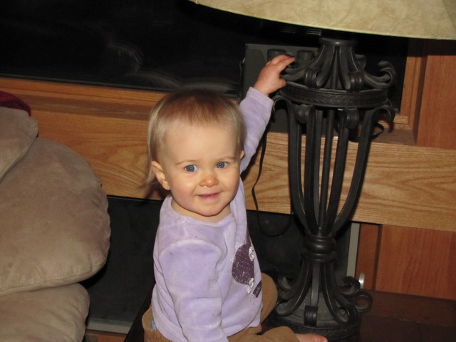 March 3: Brianna helping me test my new camera.  She's just too cute to resist as a model, even when she climbs onto the end table while I'm trying to figure out which button does what.