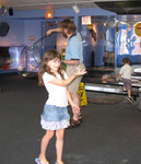 Kailyn with a 'snowman' in a 'snow globe', and Don and Connor behind her