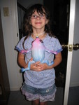 August 14: Kailyn with the amazing growing frog Grandma Gail bought her at the zoo. It used to be only about 2 inches long!