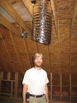 Don standing under the first suntube (Bobby cut a hole through the board in the way this morning)