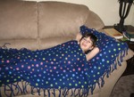 February 12: Kailyn bought a snuggle-sack and pillow making kit with the money she earned yesterday, and we put it together this afternoon.  Here she is with the results!