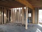 Main downstairs room, showing post and stairwell