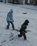 Connor throws a snowball and runs