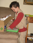 Connor learning to open his laptop (you have to raise the 'ears' first)