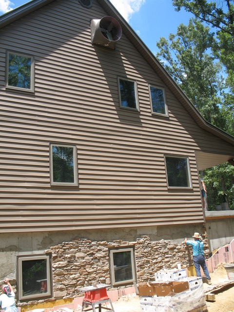 This one shows the installed and painted fan, but the paint was scraped up in the process of reinstalling it after painting. They used the lift truck to repaint it later this afternoon.
