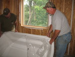 Moving the master bathtub into the bathroom