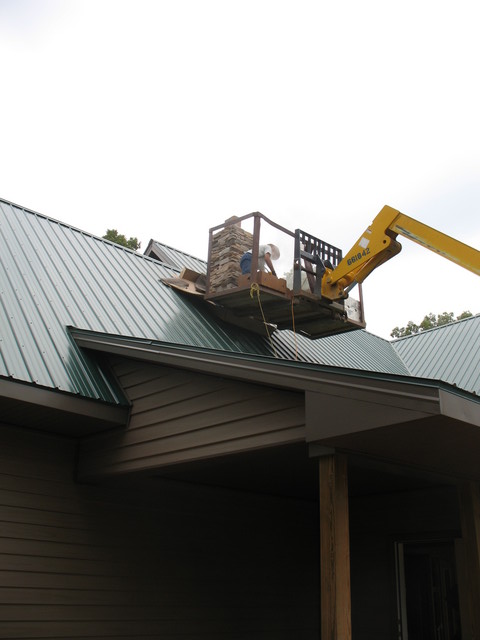 Levi working on the chimney stone
