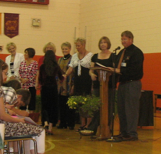 Receiving her certificate and shaking everyone's hands