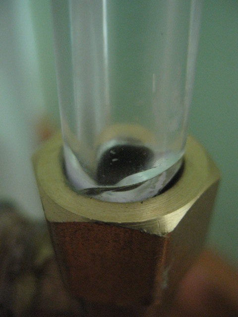 May 1: The sight glass fracture that caused the drainback tank leakage. Such a small item to make such a big mess...