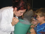 Letting all the kids feel the carbon dioxide coming off of the dry ice