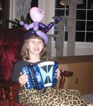 Kailyn's cat hat.  She's holding the accordion Grandma Gail gave her.